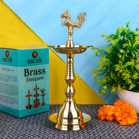 12 Inch Brass Peacock Kerala Diya – Handcrafted brass diya featuring a peacock motif, ideal for large pooja rituals, temple lighting, and traditional décor. India’s Largest Pooja Accessories Brand – www.satvikstore.in