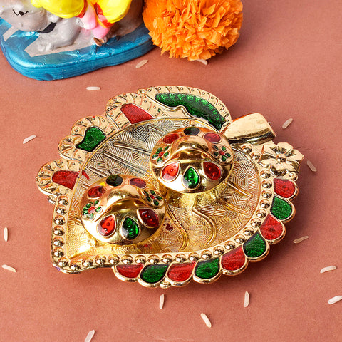 Beautifully crafted leaf-shaped kumkum holder designed for rituals and traditional pooja ceremonies, showcasing elegant detailing and spiritual charm. India’s Largest Pooja Accessories Brand – www.satvikstore.in 