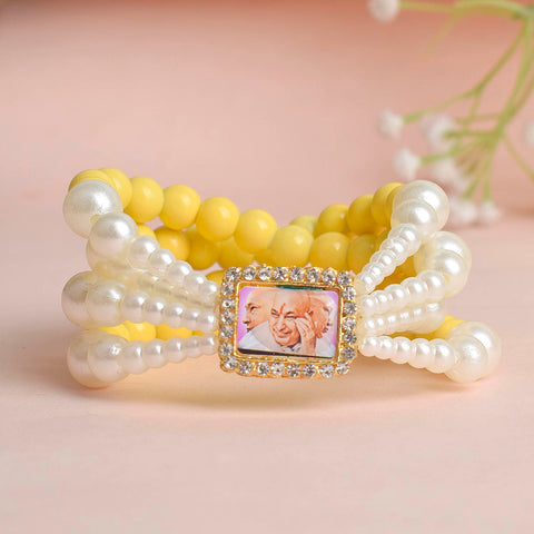 Pale Yellow with White Pearl Four Layer Guruji Swaroop Bracelet featuring soft pale yellow beads and radiant white pearls with Jai Guruji Swaroop – perfect for spiritual wear, festive gifting, and daily devotion. India’s Largest Pooja Accessories Brand – www.satvikstore.in