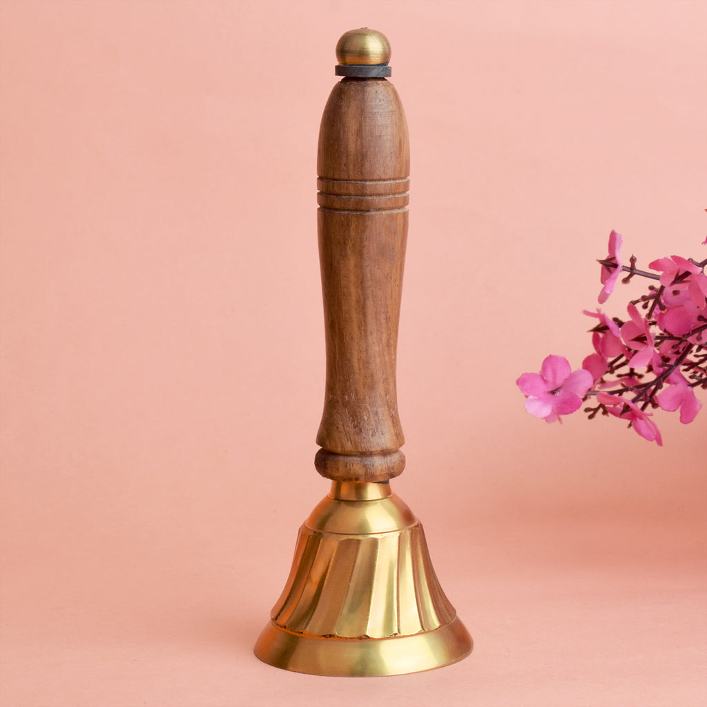 Traditional wooden handle brass bell with a polished finish, ideal for pooja rituals and temple ceremonies, offering a clear and resonant sound. India’s Largest Pooja Accessories Brand – www.satvikstore.in