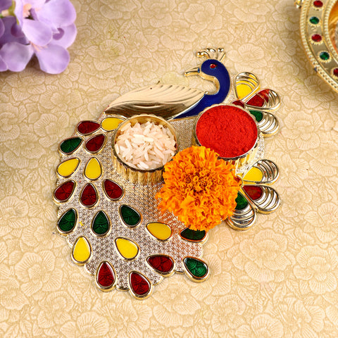 Alluring Peacock Roli Akshat Platter, beautifully designed with a peacock motif, perfect for holding roli and akshat during pooja, tilak, and festive ceremonies. 
India’s Largest Pooja Accessories Brand – www.satvikstore.in 