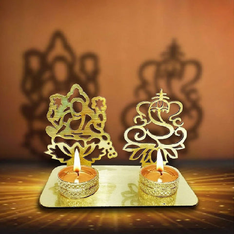 Decorative Lord Ganesha and Lakshmi Shadow Diya, a beautifully crafted metal lamp featuring the divine images of Lord Ganesha and Goddess Lakshmi, casting elegant shadows when lit. Ideal for festive occasions, puja ceremonies, and home decor. India’s Largest Pooja Accessories Brand – www.satvikstore.in